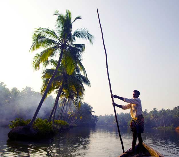 indian-boatman-through-backwaters-kerala_53876-11178